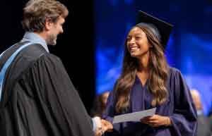 receiving diploma at commencement